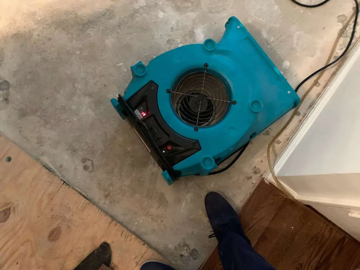 Air mover drying subfloor during Commercial Water Damage Restoration in Homestead